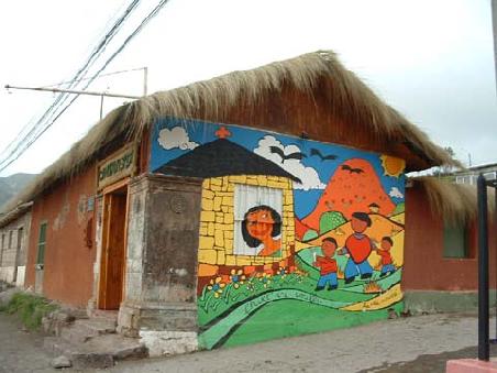 Pupils with the help of people of the culture center made paintings in a similar style on 6 different walls of the village. So we seek for all of them with Ingrid! Here one of them. They are full of hapiness.